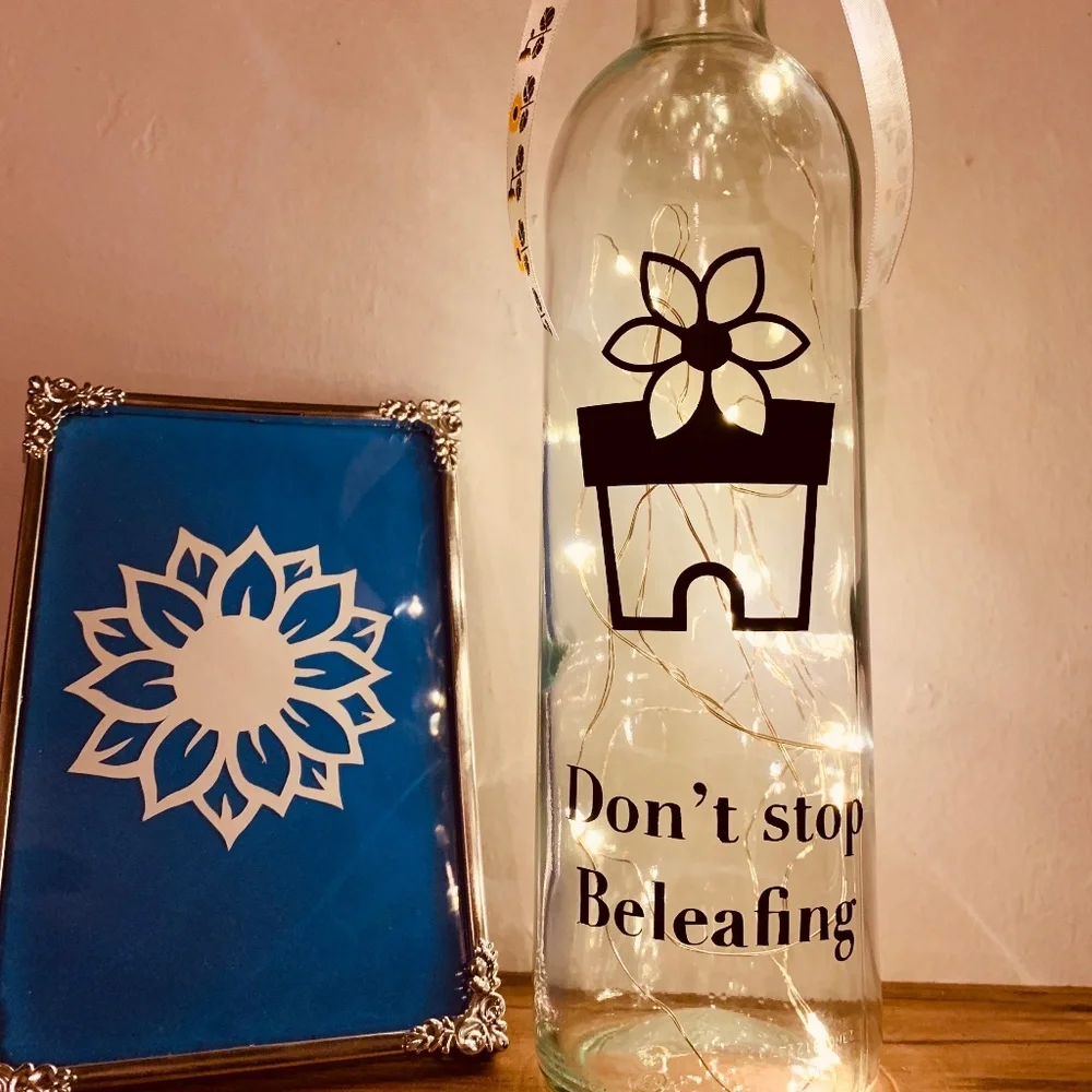 ‘Don’t Stop Beleafing’ logo wine bottle lantern